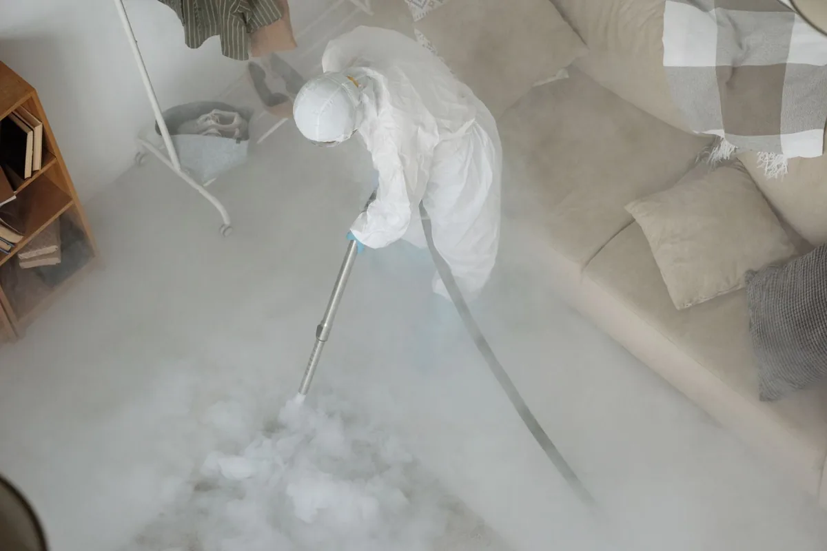 Biohazard cleanup technician in protective equipment, Port Lavaca, TX